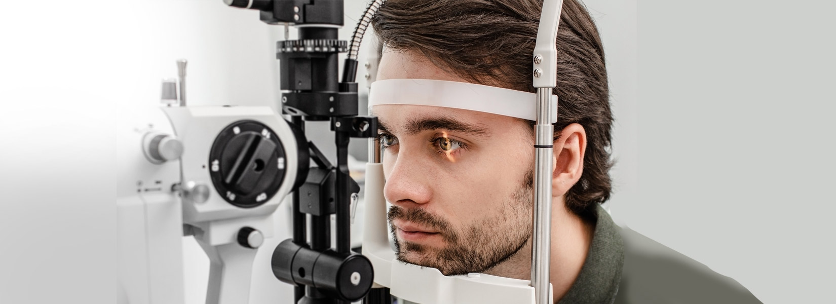 young man during eye exam in Heritage Center